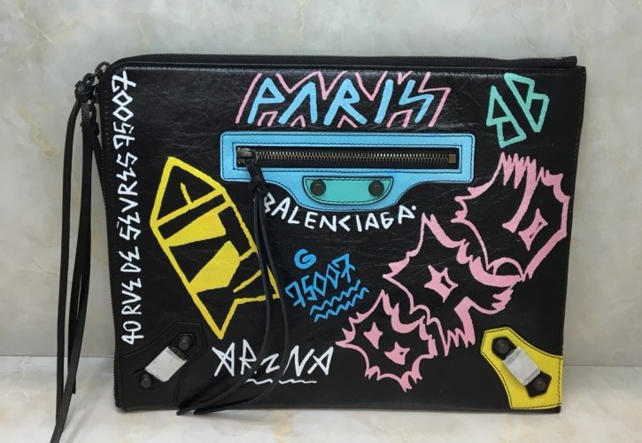 Balenciaga Graffiti Bazaar Leather Clutch Black Shines at Fashion Events
